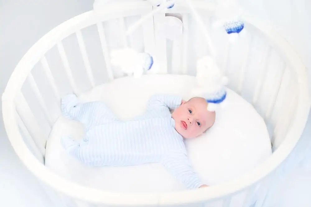 Baby in Round Crib