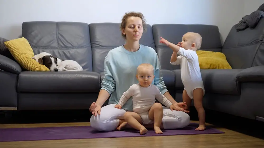 Mom practicing yoga with kids